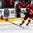GRAND FORKS, NORTH DAKOTA - APRIL 16: Switzerland's Yannick Lerch #18 shoots the puck while Russia's Alexander Alexeyev #4 defends during preliminary round action at the 2016 IIHF Ice Hockey U18 World Championship. (Photo by Matt Zambonin/HHOF-IIHF Images)

